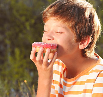 Girl eating chocolate eclair